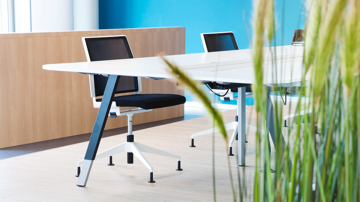 Offices and public buildings: meeting room with chairs and table on bright Forbo LVT (Allura Luxury Vinyl Tiles).