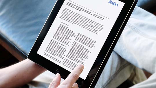 Tablet with Forbo media notice on screen.