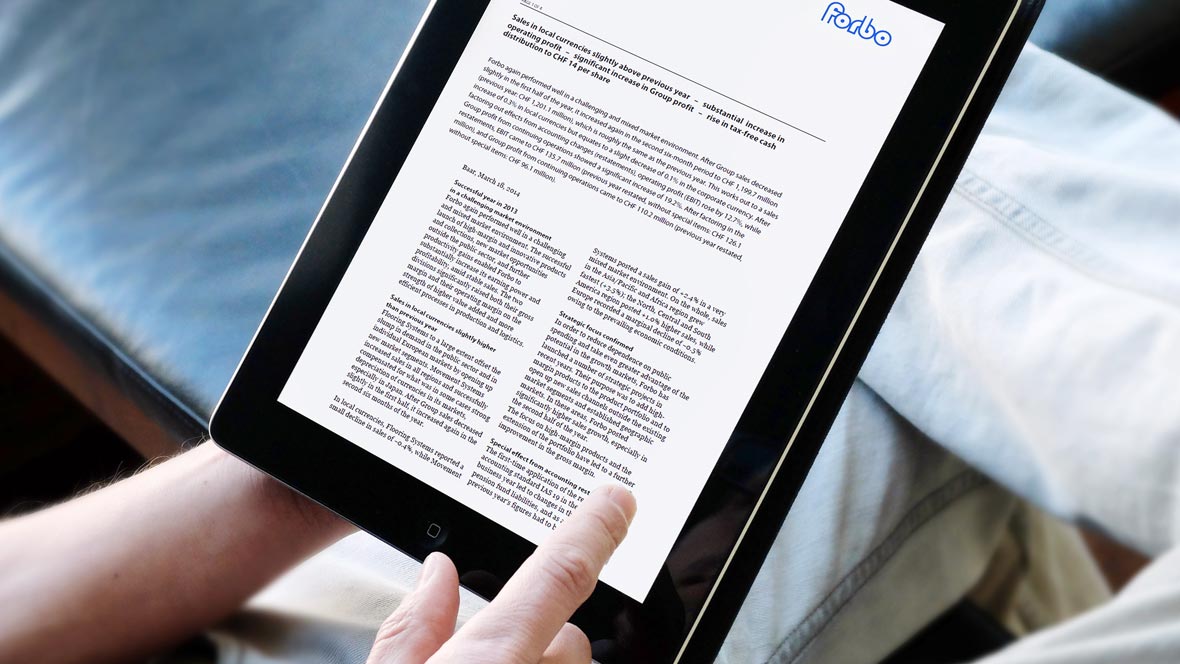 Tablet with Forbo media notice on screen.